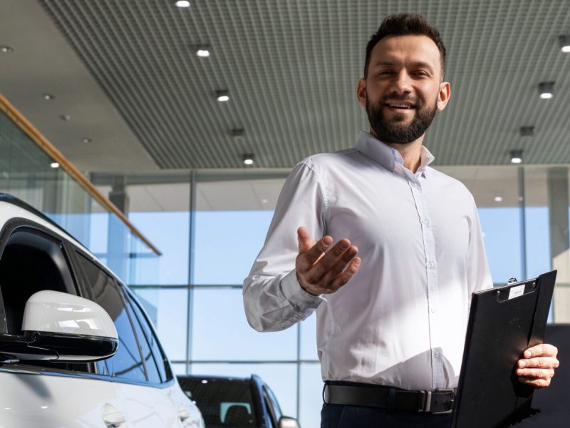 owner of a car dealership with a unique offer for new cars.
